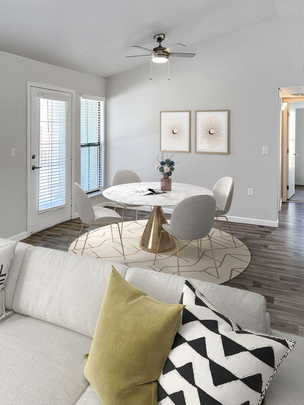 a living room with a round table and a couch