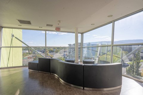 a seating area in a building with a view of the city at The Onyx at 695, Reno, 89503