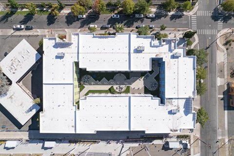 an aerial view of the roof of a white building with a green roof at The Onyx at 695, Reno, NV, 89503