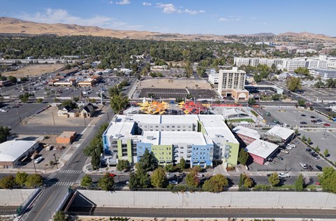 an aerial view of a city with buildings and a parking lot at The Onyx at 695, Nevada, 89503