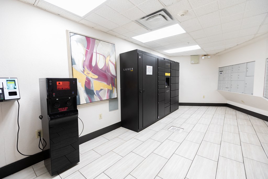 a room with black lockers and a machine on the floor at ParcOne60, Reno, 89501