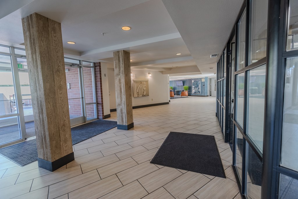 the lobby of a building with windows and rugs at ParcOne60, Reno, NV, 89501