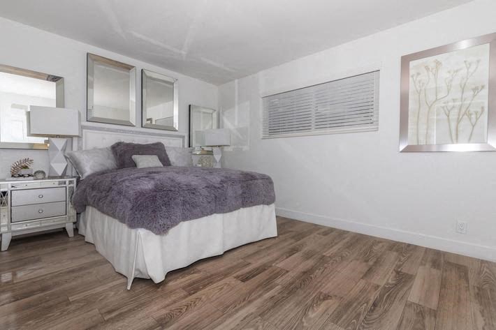 a bedroom with a bed and a window at Evoq Apartment Homes, Nevada  