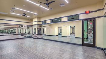 Expansive Fitness Center a wooden floor and a ceiling fan at Tuscan Highlands, Nevada