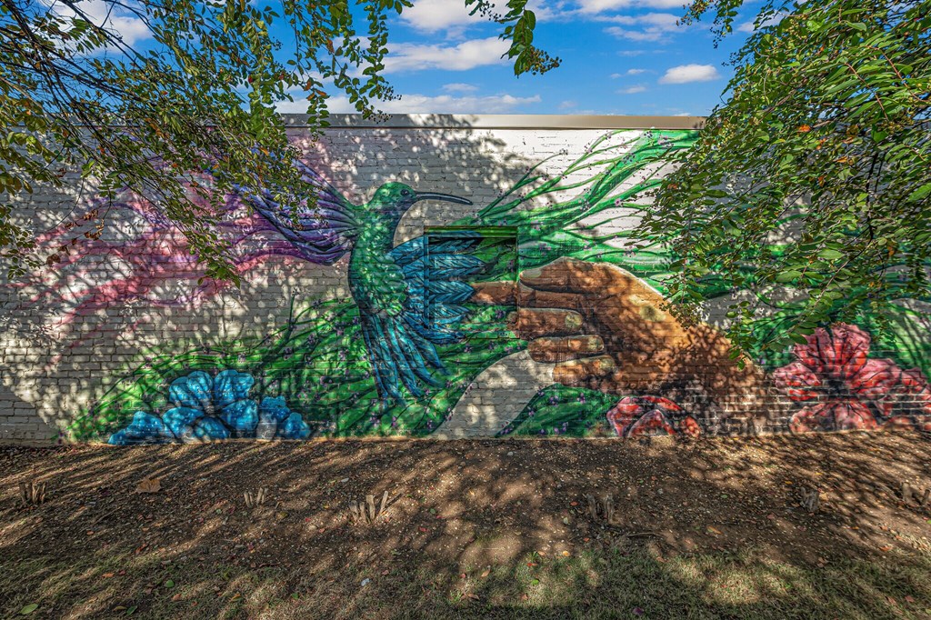 A mural of a bird painted on a wall.