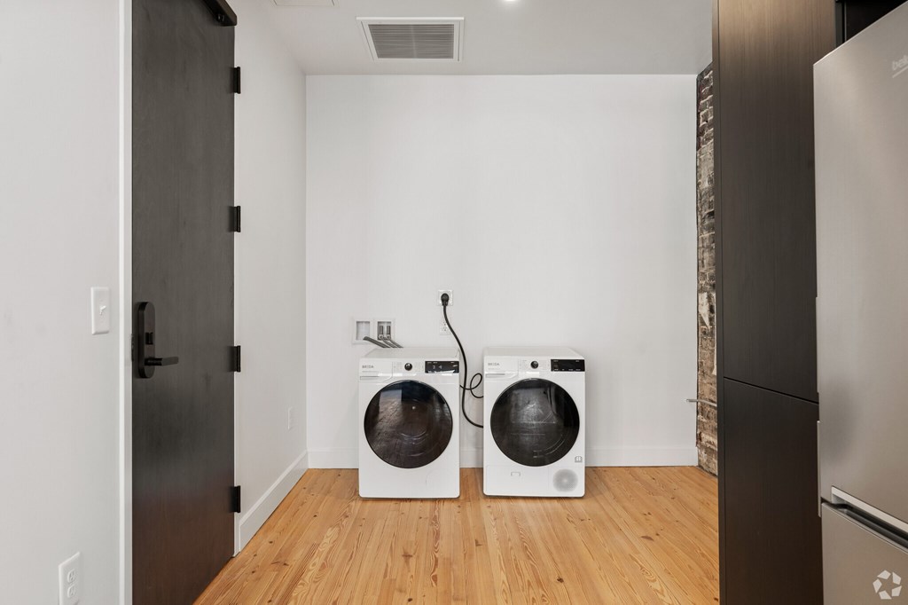 A laundry room with a washer and dryer.