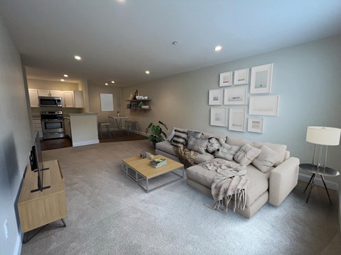 a living room with a couch and a table