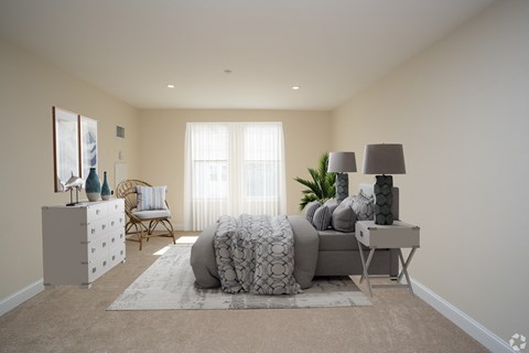 a bedroom with a bed and a dresser