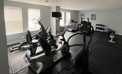 a room filled with lots of exercise equipment