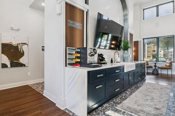 A modern kitchen with dark wood cabinets and a white countertop.