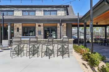 A patio area with a table and chairs.