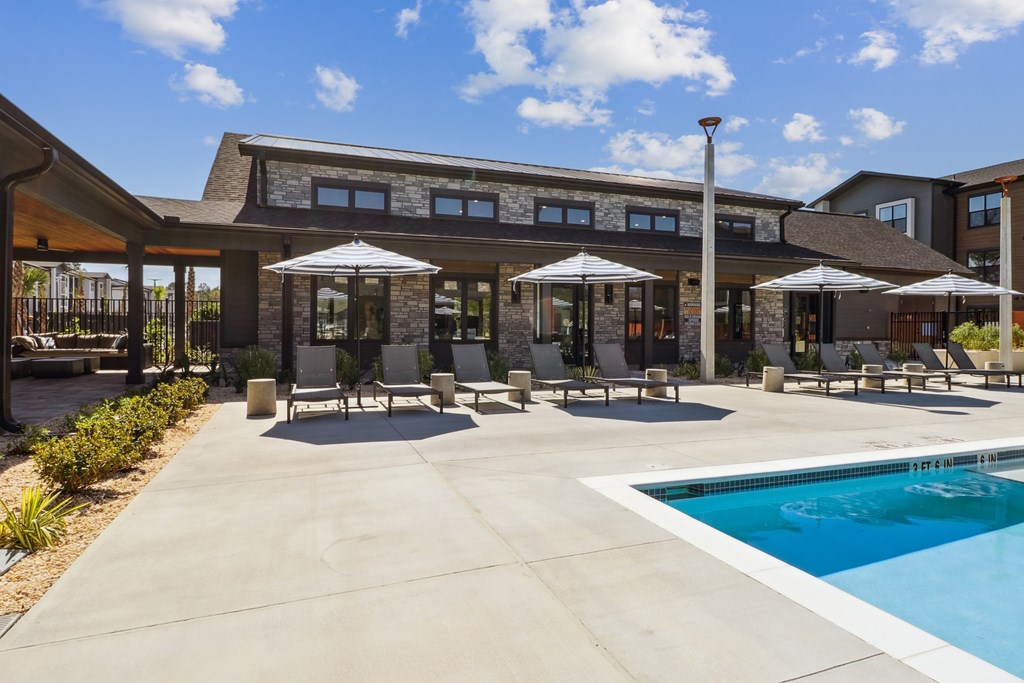 A large building with a pool in front.