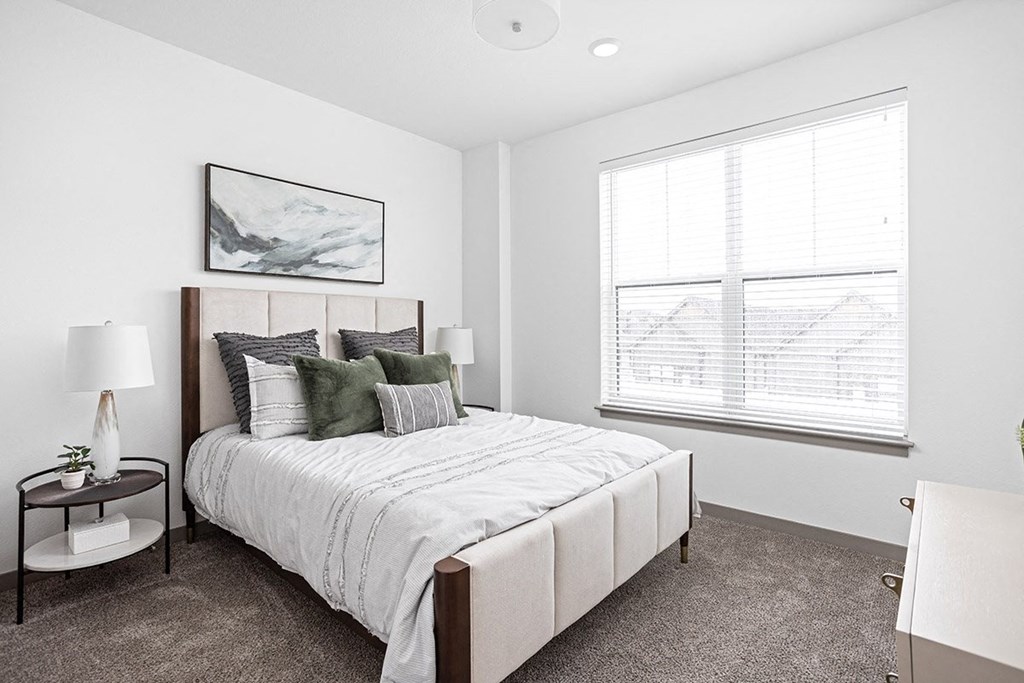 an example of a bedroom with a bed and a window