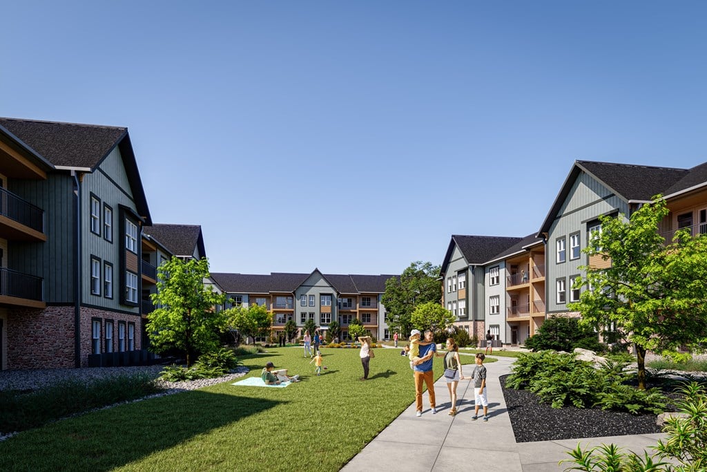 a rendering of people walking on a sidewalk in front of an apartment complex at Premier at West Park, Greeley, 80634