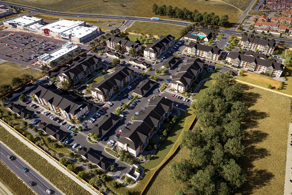 an aerial view of a suburb of a city with cars on the street at Premier at West Park, Greeley, CO