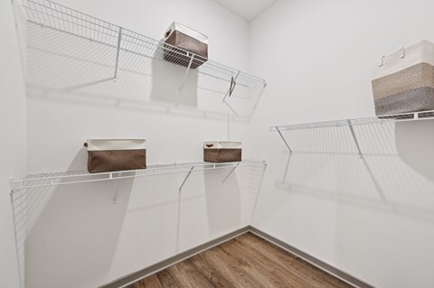 A white room with shelves and boxes on them at The Hadley - North Port, FL Apartments, Florida, 34287