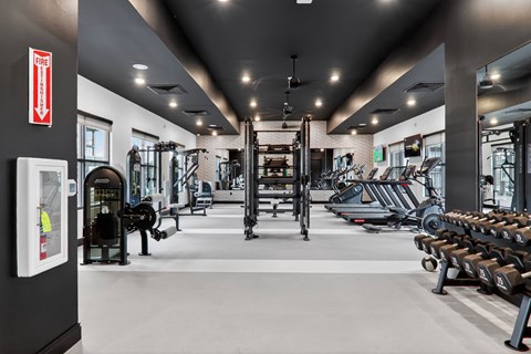Spacious fitness center with cardio and weight equipment at The Logan Luxury Apartments, Nampa, ID