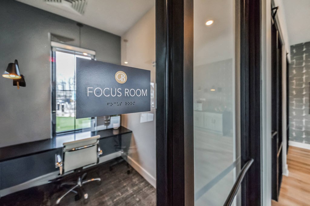 a focus room with a desk and a sign on the door at The BLVD at Wilson Crossings, Wyoming