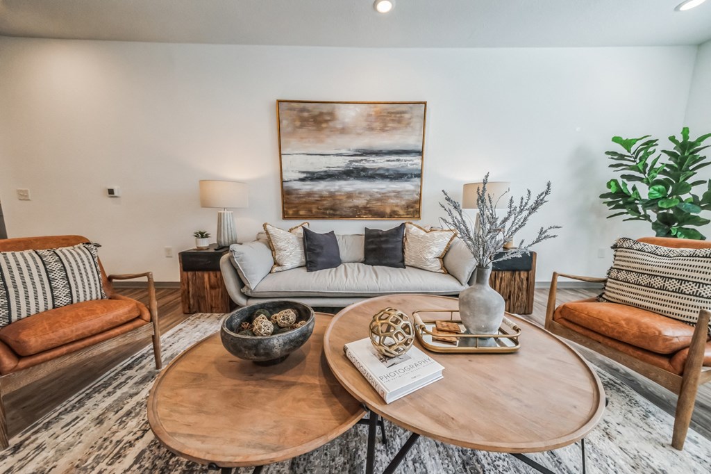 a living room with a couch and a coffee table at The BLVD at Wilson Crossings, Wyoming, 49418