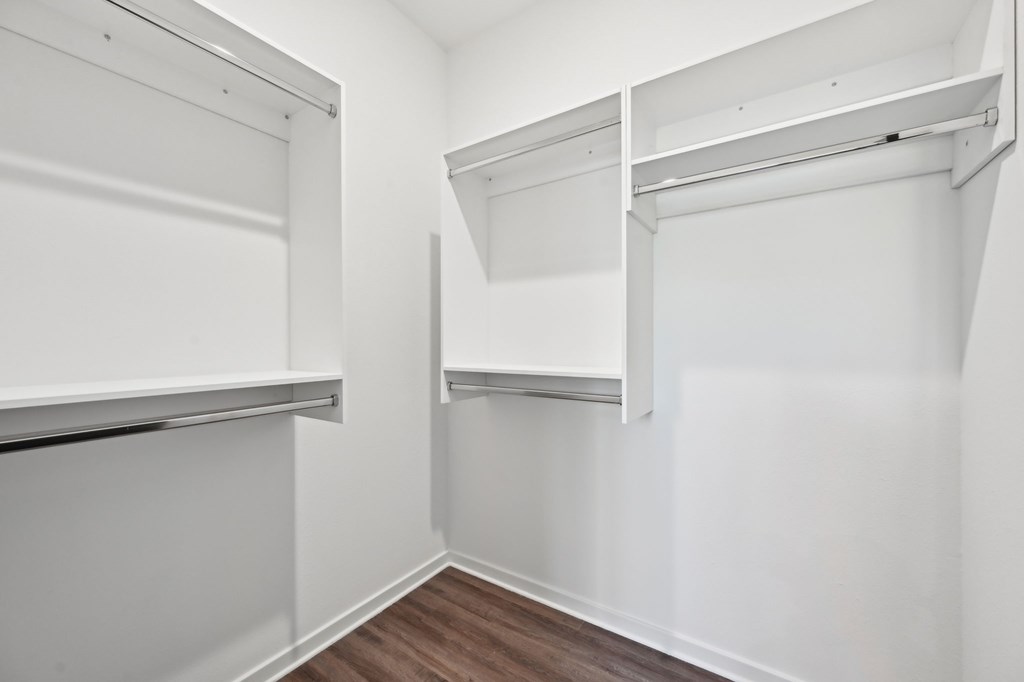 A white closet with a shelf and a hanging rod at The Concord Luxury Apartments, Florida, 34240