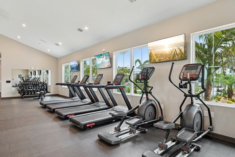 A gym with treadmills and exercise bikes at The Junction at Rockledge Apartments, Rockledge