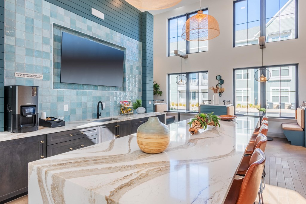 a large kitchen with a large counter top and a tv  at Taylor Farms, Charlotte