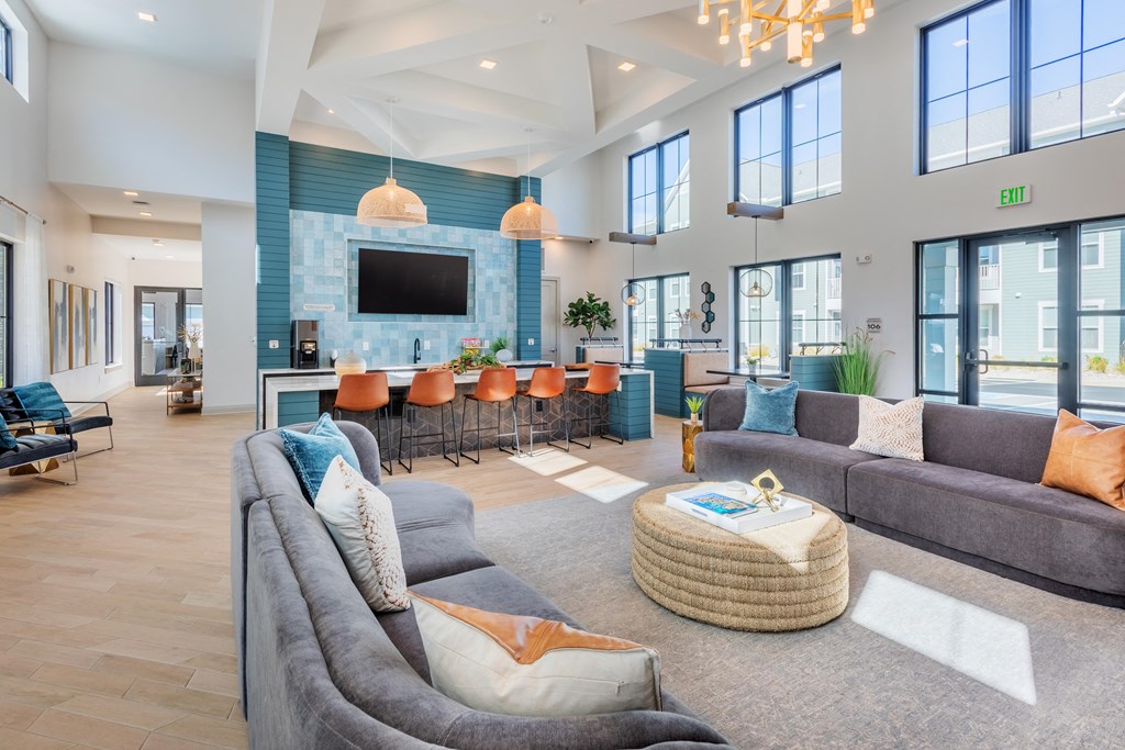 a large living room with couches and chairs and a television  at Taylor Farms, Charlotte, NC