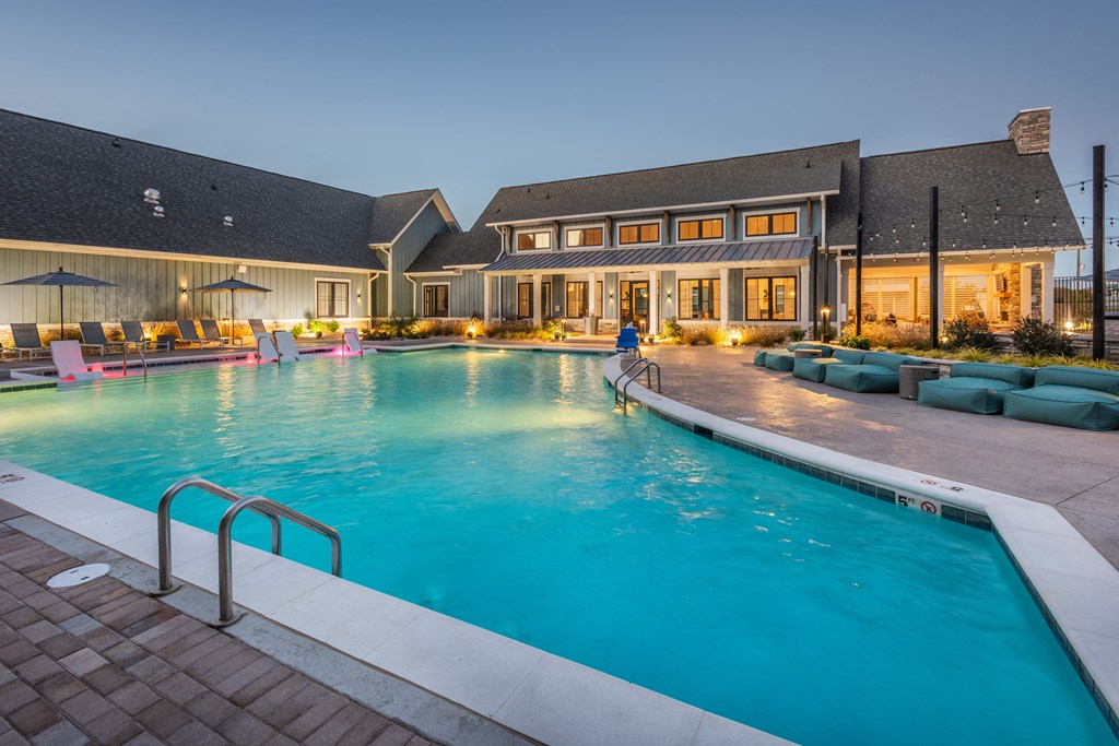 a large swimming pool with a building in the background  at Taylor Farms, Charlotte, NC, 28262
