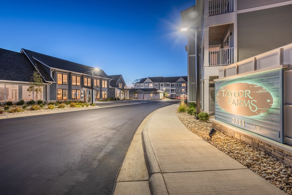 an empty street with a sign on the side of a road  at Taylor Farms, Charlotte, NC, 28262