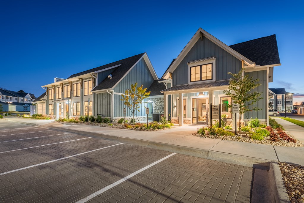 a row of houses on the side of a street  at Taylor Farms, Charlotte