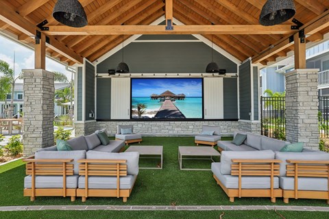 A wooden outdoor theater with a screen and seating at The Junction at Rockledge Apartments, Rockledge 32955