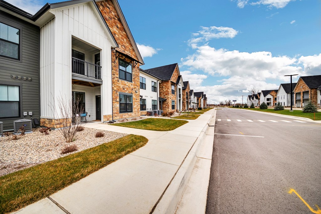 a row of houses on the side of a street at The BLVD at Wilson Crossings, Wyoming