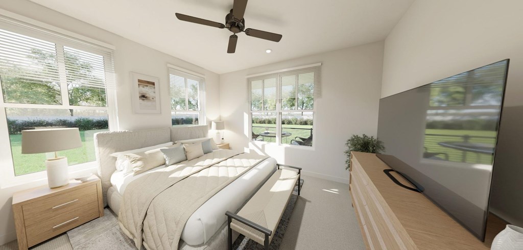 A bedroom with a large bed and a television on the wall at Switch Luxury Living in Colorado Springs, CO