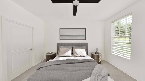 A bedroom with a bed, pillows, a ceiling fan, and a window with blinds.