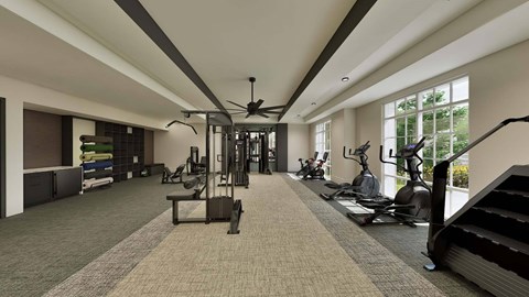 A gym with a variety of equipment including treadmills, weights, and exercise machines.