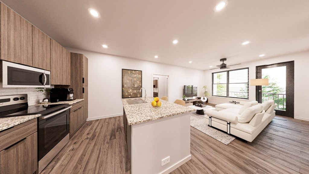 A modern kitchen with wooden cabinets and a white island.at The Landing at Lemay, Fort Collins Colorado