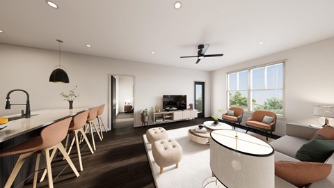 A modern living room with a long wooden dining table and chairs, a white sofa, and a round coffee table.