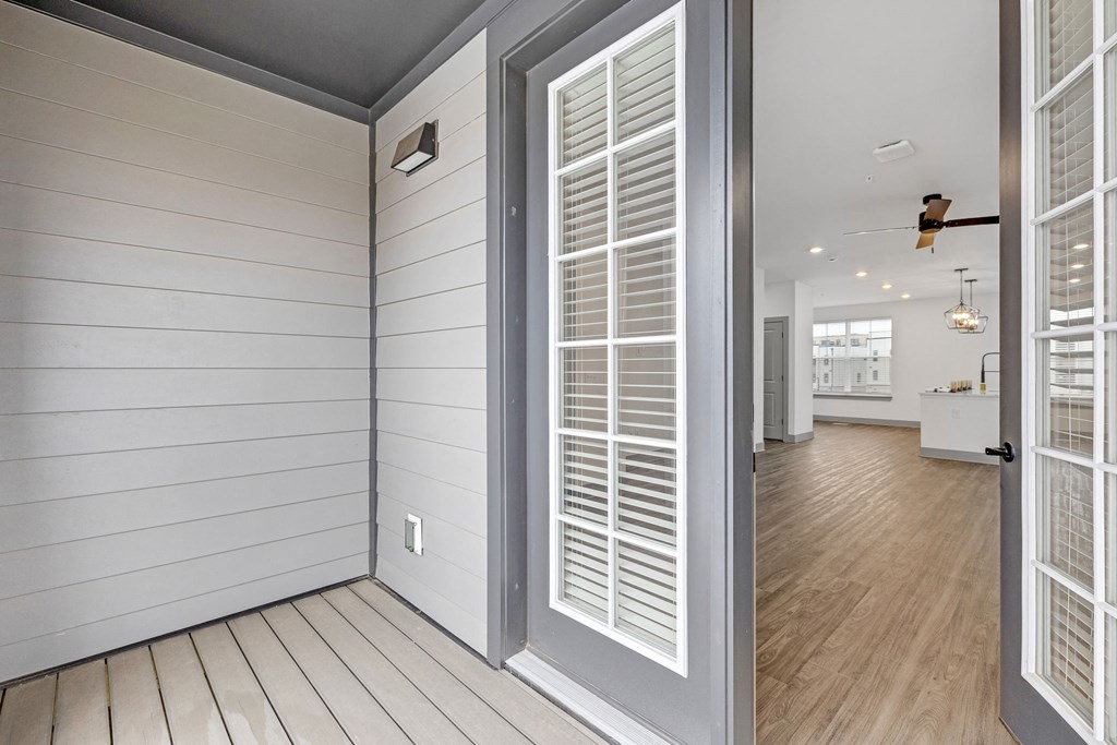 the view of a hallway from a home with white walls and doors at Meridian at CityPlace, Minnesota, 55125