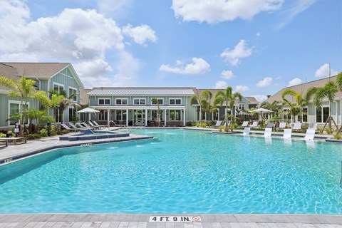 A large swimming pool with a depth of 4 feet 9 inches at The Junction at Rockledge Apartments, Florida