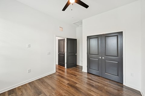 A room with a ceiling fan and two doors at The Hadley - North Port, FL Apartments, North Port 34287