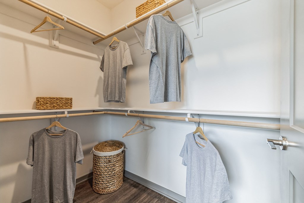 a walk in closet with white walls and wood flooring  at Prism at Diamond Ridge, Moon Township