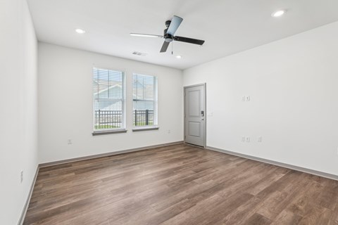 A room with a ceiling fan and wooden flooring. at The Junction at Rockledge Apartments, Rockledge, FL, 32955