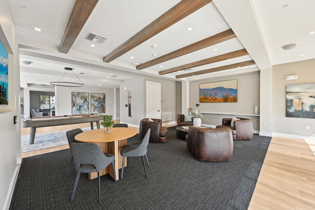 A modern living room with a wooden table and chairs at The Concord Luxury Apartments, Florida, 34240