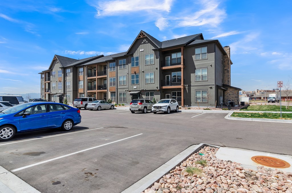 a parking lot at the whispering winds apartments in pearland, tx at Apex, Colorado Springs, CO, 80923