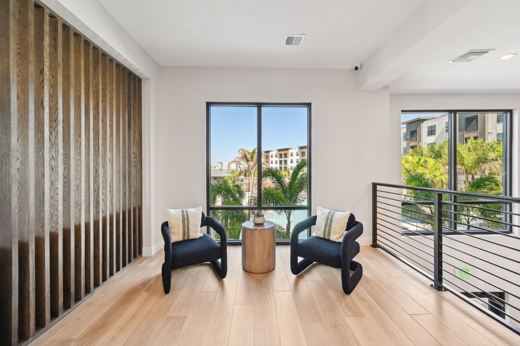A modern living room with a view of the city at The Concord Luxury Apartments, Sarasota, Florida