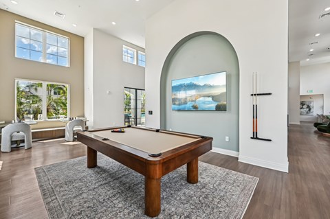 A pool table in a room with a painting on the wall at The Hadley - North Port, FL Apartments, Florida, 34287