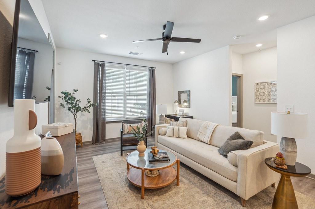 a living room with a couch and a coffee table  at Taylor Farms, Charlotte, NC