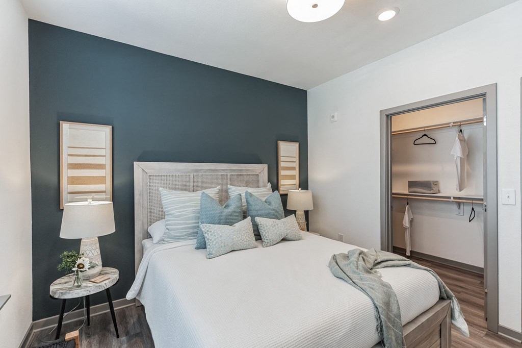 a bedroom with a bed and a desk in a room  at Taylor Farms, Charlotte
