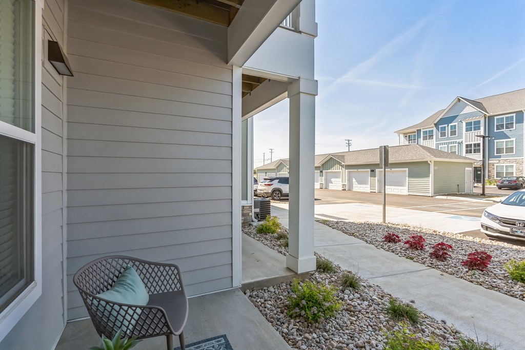 a chair sitting on a porch in front of a house  at Taylor Farms, North Carolina, 28262