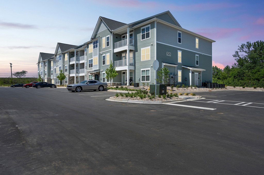 a large apartment building with a parking lot in front of it  at Taylor Farms, Charlotte, North Carolina